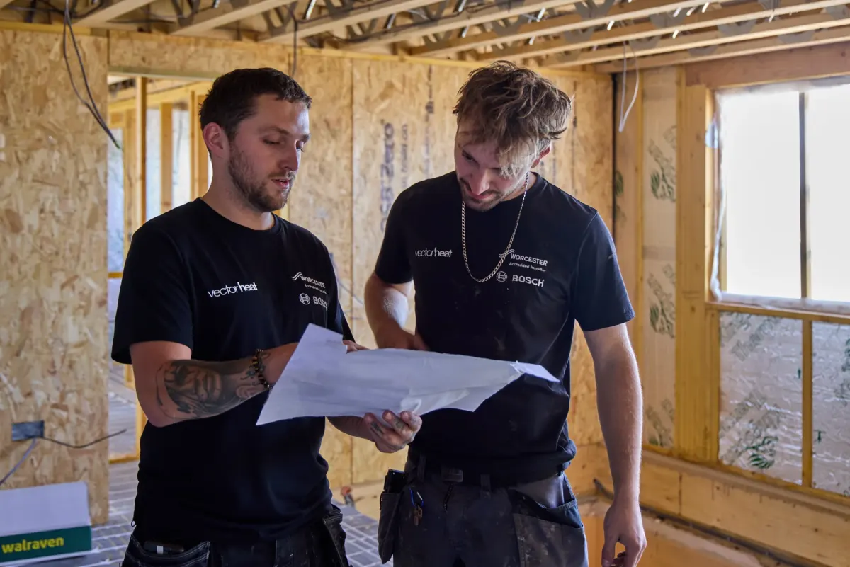 Vector Heat engineers reviewing plans on site