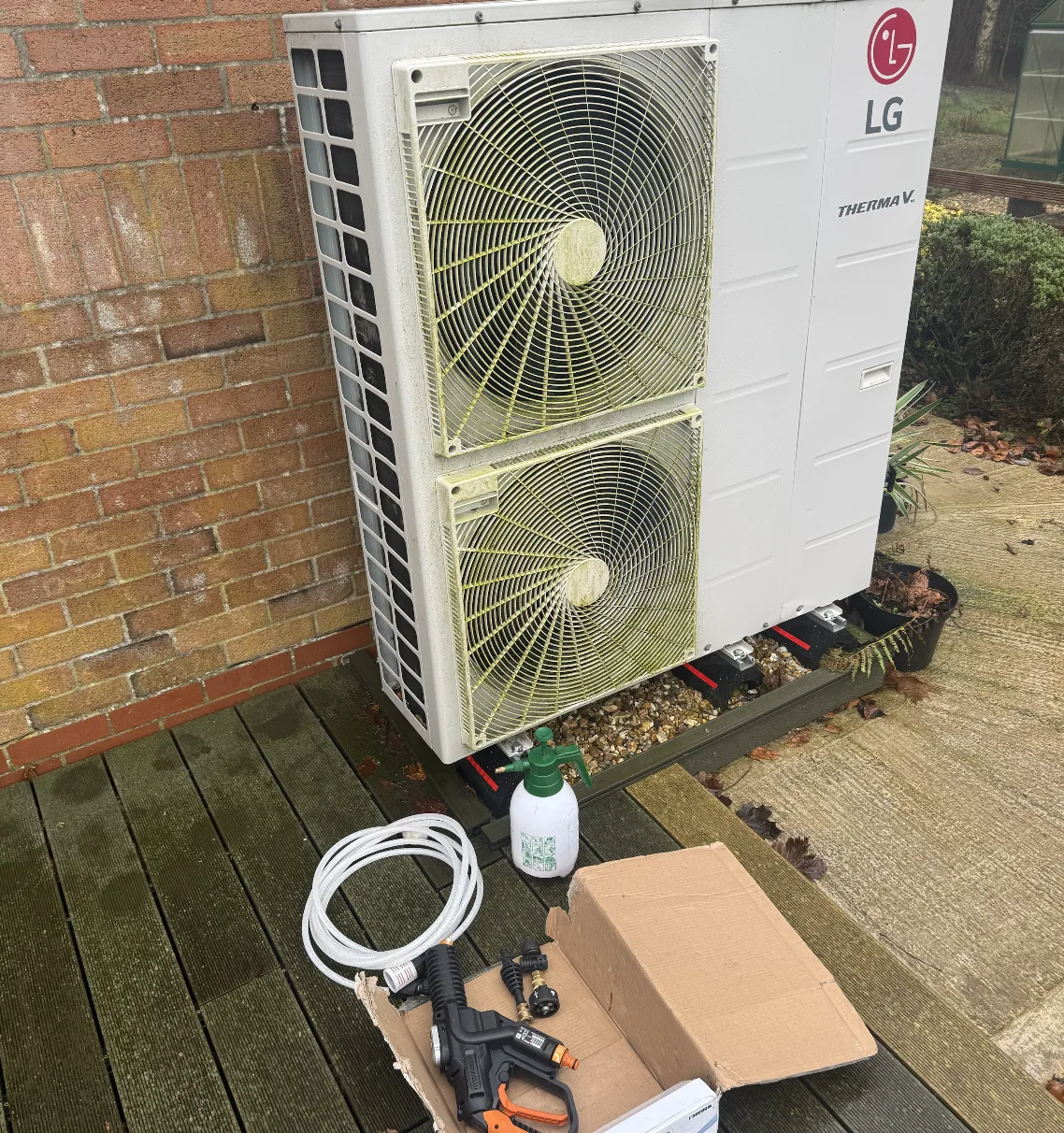 Battery pressure washer and condenser cleaner ready for cleaning an LG air source heat pump outdoor unit