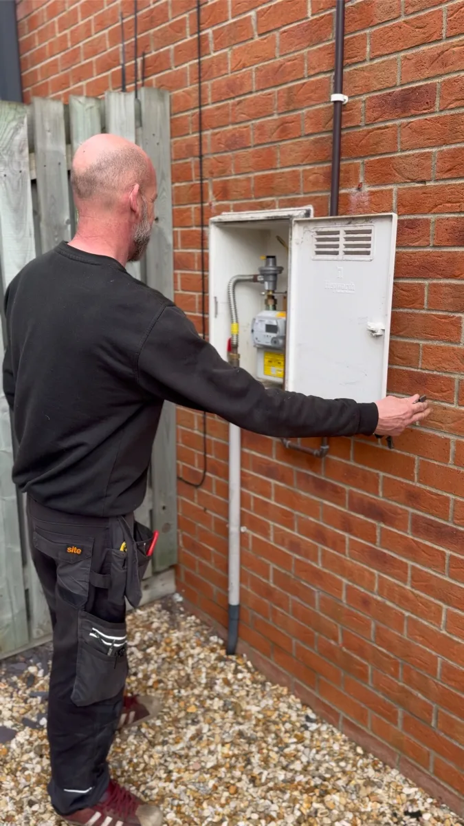 Vector Heat Gas Safe engineer checking a gas meter at a Lincoln property