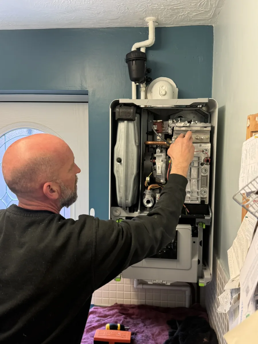 Vector Heat engineer Mat working inside a boiler during a service