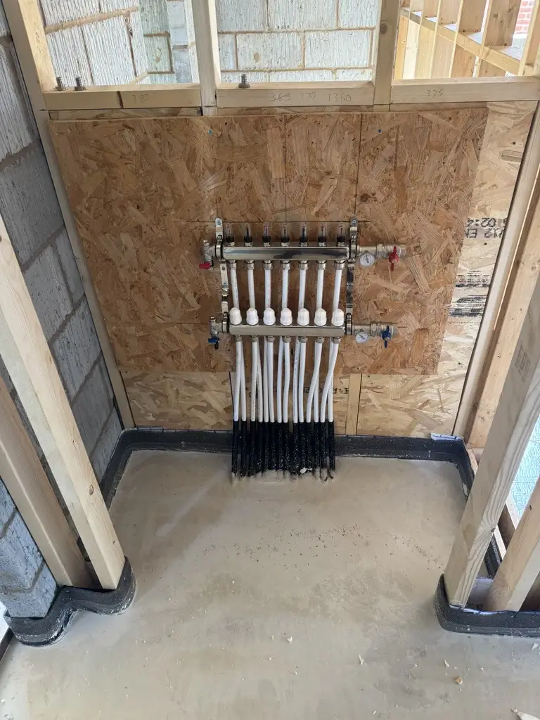 Underfloor heating manifold installed as part of a Vector Heat new-build project