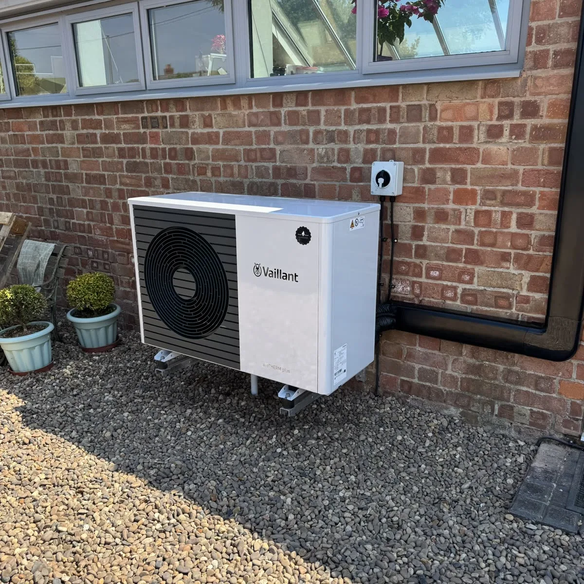 Air source heat pump installed with space for servicing and maintenance access