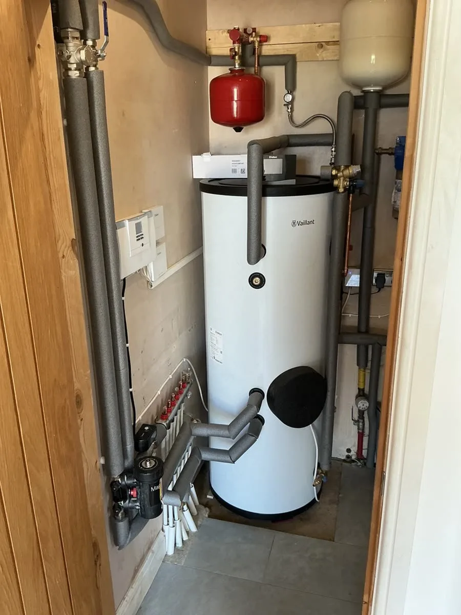 Heat pump cylinder, expansion vessel and underfloor heating manifold checked during servicing