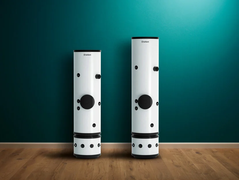 Two Vaillant uniSTOR Plus slimline cylinders with optional buffers below, against a green wall